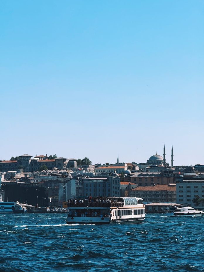 istanbul skyline with bosphorus ferry at daytime
