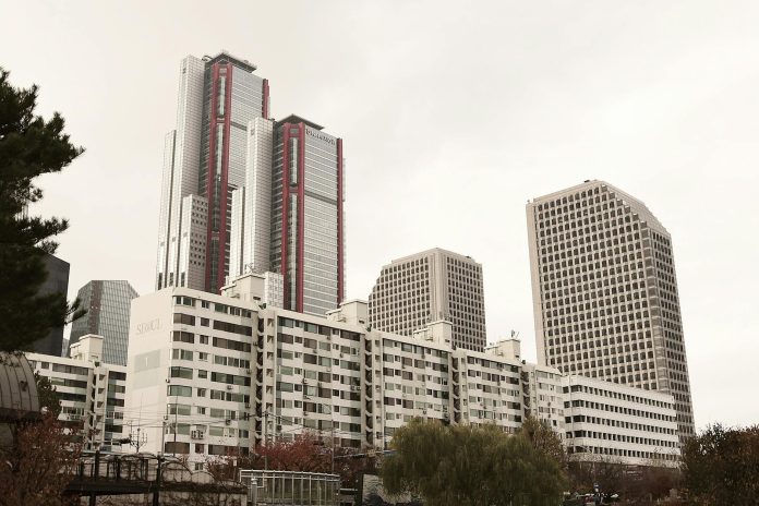 tall buildings surrounded by trees